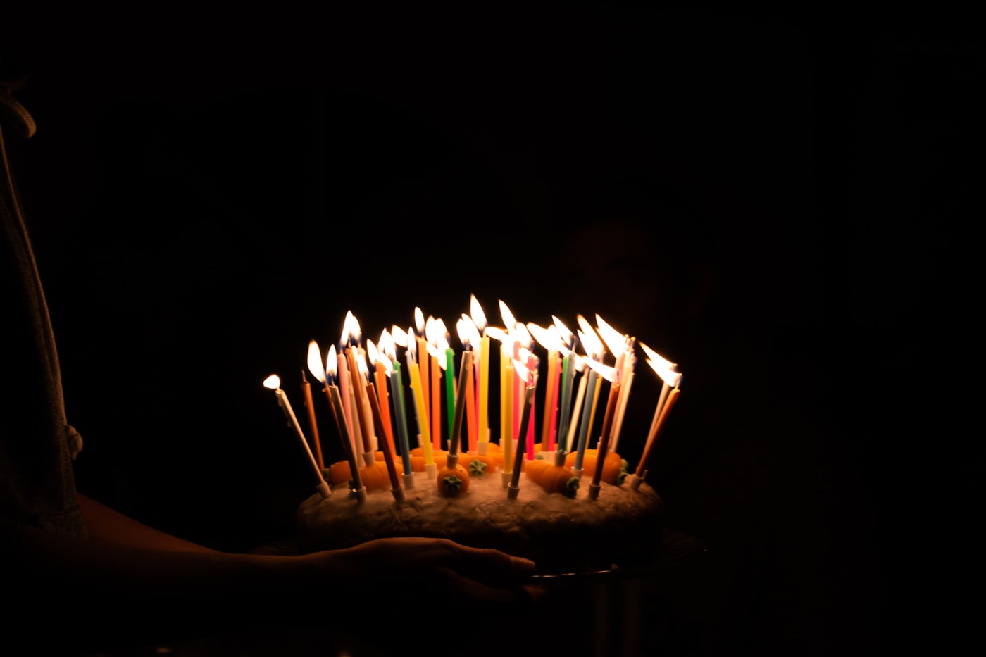 Birthday cake candles glowing softly